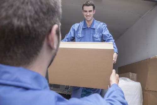 Removal team preparing a safe moving operation with equipment and protective measures