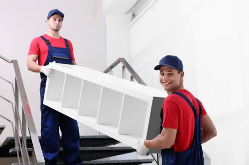Customer complaint documents beside moving boxes and packing materials