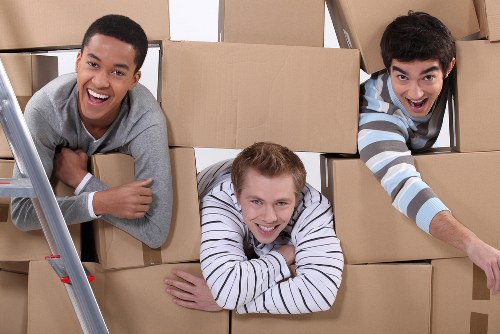 Packed boxes and furniture ready for a moving van in Camden