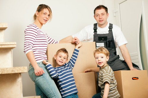 Removal team loading boxes in a Camden street