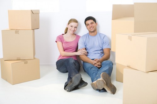 Removal company staff reviewing a service issue with paperwork