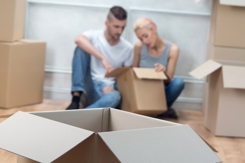 Professional movers handling furniture in a Camden apartment building