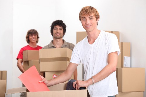 Unpacking boxes in a Camden flat to help a household settle in quickly